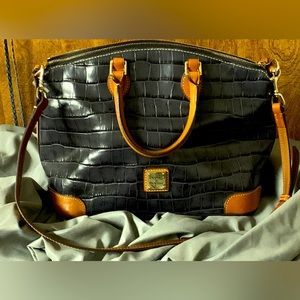 Dark grey Dooney & Bourke purse with shoulder strap. Excellent condition.